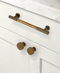Antique Brass Kitchen Cabinet Knobs 10 Pack Zinc Drawer Pulls installed on white cabinets in kitchen