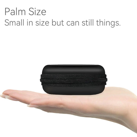Hard Protective Earphone Case For Earbuds And Headphones Ultra Compact Carrying Pouch shown on an open palm, black.