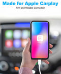 Person holding iPhone with USB A To Lightning CarPlay Cable For iPhone 14 13 12 11 Pro Max XR XS X Three Foot Fast Charging in car