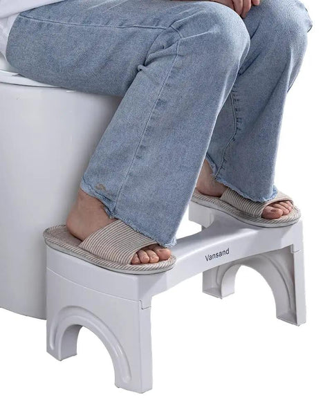 Person using Foldable Toilet Stool Foot Rest Made For Real Squat Posture 7.5 Inch White Bathroom Hack To Ease Straining And Beat Constipation Sturdy ABS Build Portable Squatting Potty For Home