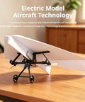 Electric Remote Control Paper Airplane DIY Kit With Gyro Stabilizer And Dual Propellers on wooden table