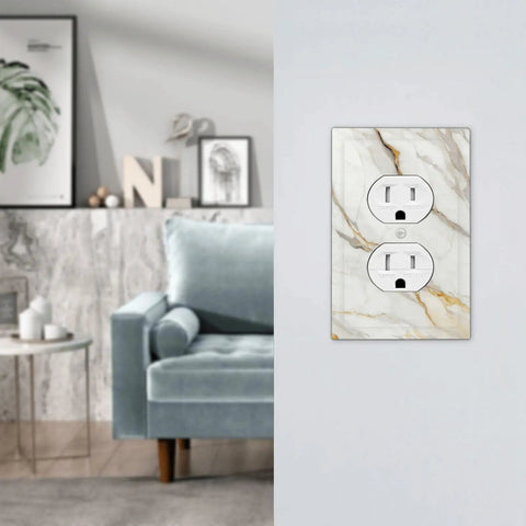 Sleek White And Gold Marble Abstract Light Switch Covers And Wall Plates Tough As Nails Polycarbonate Outlet Faceplates on wall in modern living room.