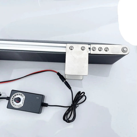 Stainless Steel Electric Conveyor Belt With Adjustable Speed Flat Drive PVC Desktop Belt for packaging, top view of controls and belt.