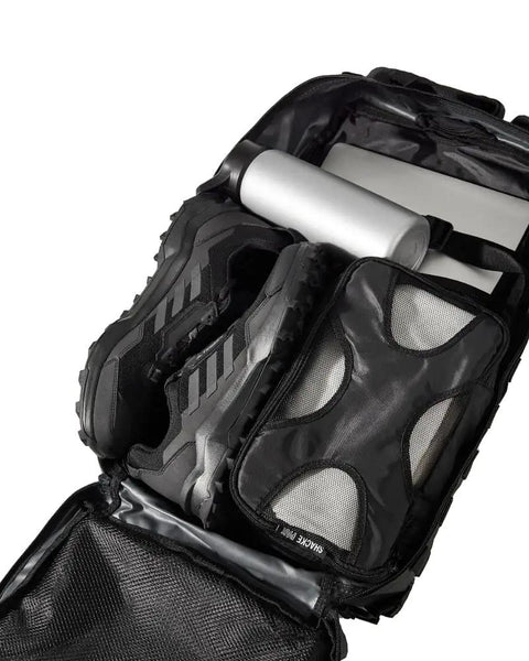 Open Rugged 50L Tactical Backpack For Men And Women With Two Point Four Times Stronger Fabric showing packed gear and shoes