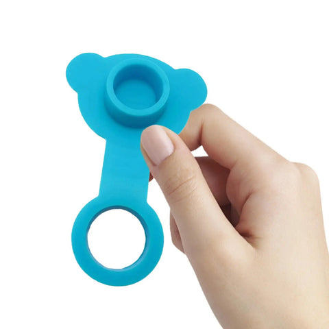 Blue Silicone Bathtub Drain Stopper Leakproof for Bath Tubs, held in hand, showing rounded bear design and drain opening.