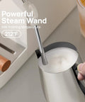 Next Level Drip 20 Bar Espresso Machine With Auto Milk Frother And Pro Steam Wand for frothing milk in stainless pitcher.