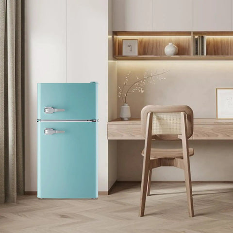 Hella Spacious 3.5 Cubic Feet Retro Mini Fridge With Handle Compact Refrigerator in blue against wooden desk and chair.