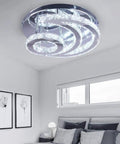 Moon Shape Crystal LED Chandelier Flush Mount Ceiling Light With Modern Stainless Steel Frame And K9 Crystals in a bedroom.