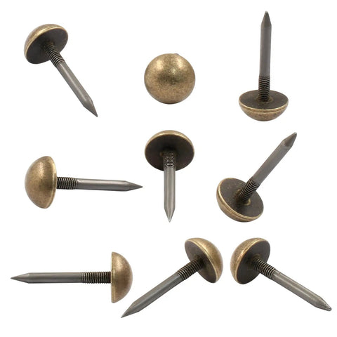 Premium Antiqued Brass Upholstery Tacks 24 Piece Set Heavy Duty Furniture Nail Heads, half-inch round with pointed shaft.