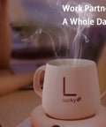 Keep Your Daily Brew Piping Hot On This Stylish Electric Coffee Mug Warmer with steaming coffee in a pink mug.