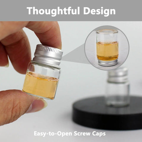 Four Pack 5ml Glass Jars With Lids Tiny Mini Bottles for DIY Crafts, held in hand, showcasing easy-to-open screw caps.