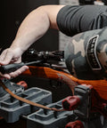 Person using No Sweat 89 Piece Gunsmithing Screwdriver Set With Hollow Ground Bits And Textured Rubber Drivers on rifle for maintenance.