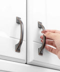 Hand holding one of 10 Pack 3 Inch Oil Rubbed Bronze Cabinet Pulls For Kitchen Cabinets Drawers Dressers Cupboards Solid Metal Hardware