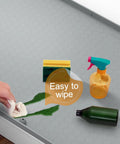 Under Sink Silicone Mat 28 By 22 Inch Waterproof Flexible Liner With Drain Hole Gray for kitchen cleanup demonstration with spills.