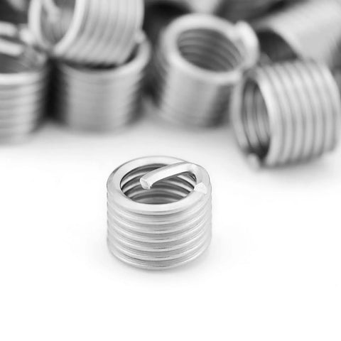 Heavy Duty Stainless Thread Repair Inserts Kit 100 Pieces M6x1.0x1.5D Locking Type Rock Solid Aircraft And Automotive Connections Durable 304 Stainless Steel Wire Sleeve, close-up of individual insert