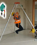 Heavy Duty Emergency Rescue Tripod With Steel Winch For Confined Space Safety And Fall Protection Gear in use, showing operation with a man suspended.