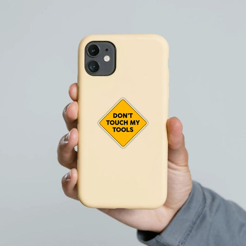 "Don't Touch My Tools Sticker 5x5 Inch Large Yellow Warning Vinyl Decal Waterproof For Tool Boxes Hard Hats Garage Cabinets And Truck Bumpers A Funny Quote Gift For Men" applied to a phone case.