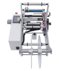 Straight Up Reliable Semi Automatic Bottle Labeling Machine With Fast Electric Label Applicator For Round Containers Featuring Rock Solid Fiber Sensor Setup Perfect For Glass Plastic And Metal Bottles 20 To 120 Mm, top view of labeling machine with sensors.