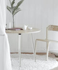 Round table with Sturdy As Heck 28 Inch Folding Table Legs Set Of 4 Chrome Metal Collapsible DIY Furniture Legs in a cozy room.