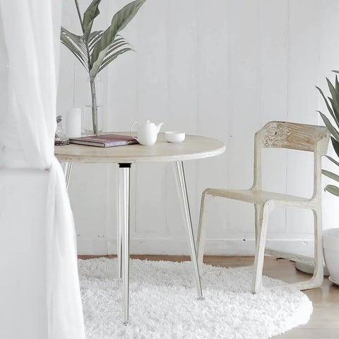Round table with Sturdy As Heck 28 Inch Folding Table Legs Set Of 4 Chrome Metal Collapsible DIY Furniture Legs in a cozy room.