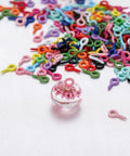 Grab These Dope Colorful Screw Eye Pins For Your Next DIY Jewelry Crafter Featuring Solid Metal Build And Rust Proof Coating In Mixed 1Mm 4Mm 8Mm Dimensions with colorful eye pins and a charm.