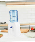 Portable Mini Cold Water Dispenser For Countertop Bottled Water Holder With Slip Design Easy To Clean Space Saving Great For Office And Home Use Grab And Go Compact Desk Side Water Solution on a kitchen counter