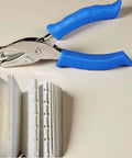 Photo of Blue One Circle Hole Punch With Soft Grip Handheld Paper Punch for crafts and card making next to punched paper samples