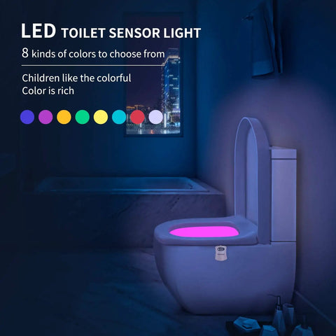 Motion Activated Toilet Night Light With 8 Color LED illuminating a bathroom toilet, showing pink light mode in dark.