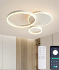 Dimmable 3 Ring Ceiling Light With Remote Control, Adjustable 3000K-6000K, 54W LED Fixture in modern room with remote shown