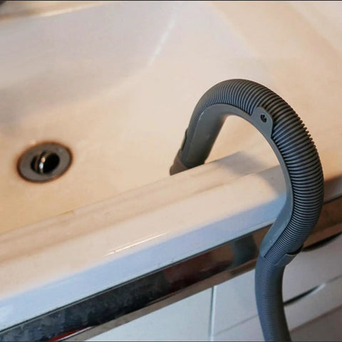 U Shape Drain Hose Holder For Washer And Dishwasher 2 Pack Gray Plastic Wall Mount Bracket installed over a sink edge