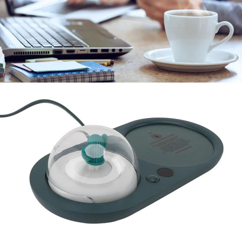 Smart Electric Cup Warmer Base With Three Adjustable Heat Modes To Keep Your Favorite Drinks Piping Hot While You Knock Out Tasks At Home Or In The Office on a desk with a coffee cup.