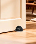 Ditch The Door Swinging Wild And Save Your Paint With These Heavy Duty Floor Mounted Door Stop Pair Black Anti Slam Wall Protectors Tight Gap Fit Solid Core Home Essential placed under a door.