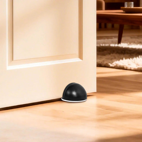 Ditch The Door Swinging Wild And Save Your Paint With These Heavy Duty Floor Mounted Door Stop Pair Black Anti Slam Wall Protectors Tight Gap Fit Solid Core Home Essential placed under a door.