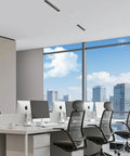 Sleek black trim Linear Recessed Downlight in modern office ceiling, enhancing workspace with smooth triac dimming.