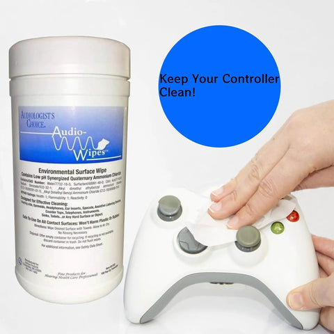 Audio Wipes large canister next to a white game controller being wiped with a cloth