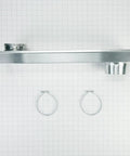 Top view of Genuine OEM Telescoping Dryer Vent Kit Stainless Steel, Adjustable To Eighteen Inches, with clamps on grid background.
