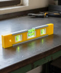 Spirit Level, Aluminum Alloy on a workbench with two levels visible, ideal for accurate measurements.