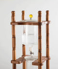 Badass Cold Brew Drip Tower Holds 25 Cups With Solid Wood Base, Slow Drip Ice Coffee Maker with transparent water chamber.
