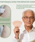 Elderly man holding Silicone Adhesive Bandages For Fragile Skin 2x4 Inch XL Pack Of 20 with skin-friendly silicone adhesive.