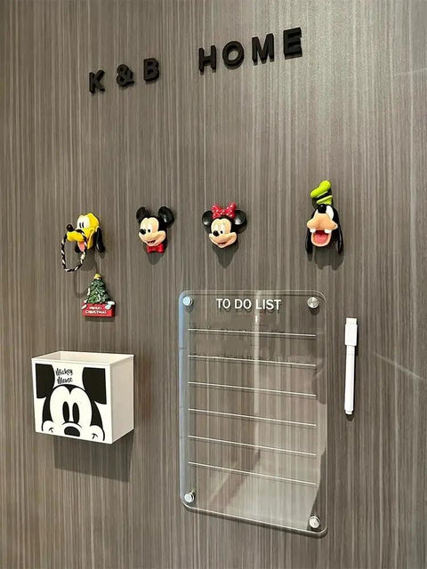 K&B HOME wall with Mickey Mouse themed hooks, white to-do list box, and clear acrylic board for notes.