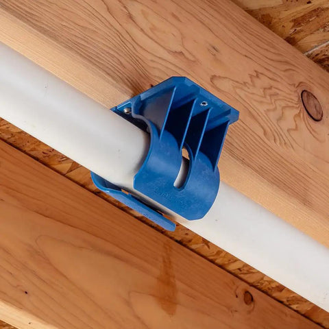 Premium Rockler Dust Right 4 Inch Hose Cradles holding PVC pipe against wooden beams, sturdy heavy duty ABS clamps in use.