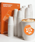 8 Oz Disposable Paper Coffee Cups, 100 Count, Leakproof White Cups displayed with latte art in foreground