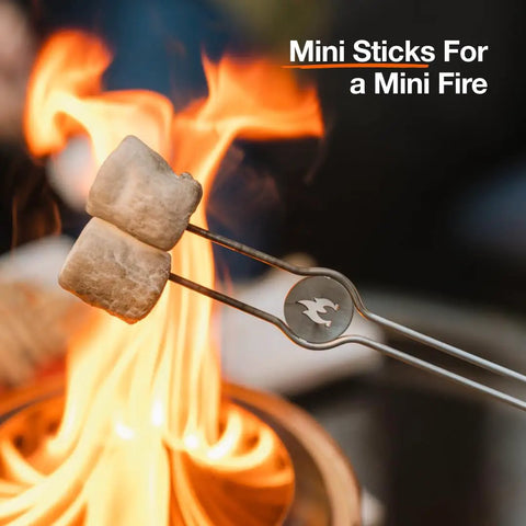Mesa Outdoor Fire Pit Accessory Pack With 4 Stainless Steel Mini Sticks roasting marshmallows over flames