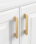 Champagne Bronze Cabinet Pulls 5 Inch Center To Center, 10 Pack Zinc Alloy Cabinet Handles installed on white cabinet doors.