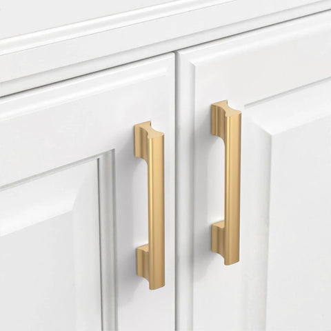 Champagne Bronze Cabinet Pulls 5 Inch Center To Center, 10 Pack Zinc Alloy Cabinet Handles installed on white cabinet doors.