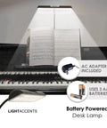 Cordless Desk Lamp With Adjustable Gooseneck, Super Bright Battery Powered LED Light, shown illuminating piano sheet music.