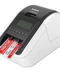 Ultra Fast Network Label Printer With Bluetooth And Ethernet Wireless Connectivity Slick Monochrome Printing Up To One Hundred Ten Labels Per Minute showing a printed visitor badge.