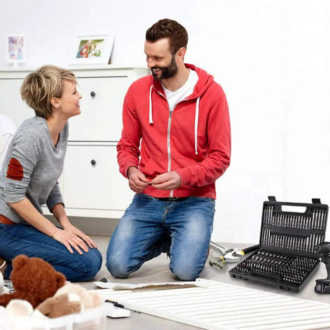 Couple using 208 Piece Screwdriver Bit Set With Security Bits in a living room, open case showing chrome vanadium steel tools