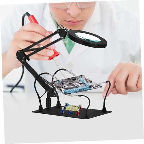 Person using Adjustable Soldering Arm With Magnifying Glass And Lamp Clamp Handy Multi Tool For Welding And Electronics Workstation