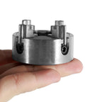 Top Tier Heavy Duty Four Jaw Mini Lathe Chuck Kit Featuring Rock Solid Zinc Alloy Construction, compact size in hand.